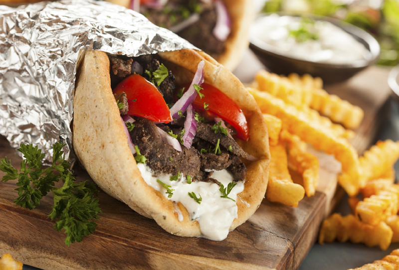 Homemade Meat Gyro with French Fries Homemade Meat Gyro with Tzatziki Sauce, tomatos and French Fries